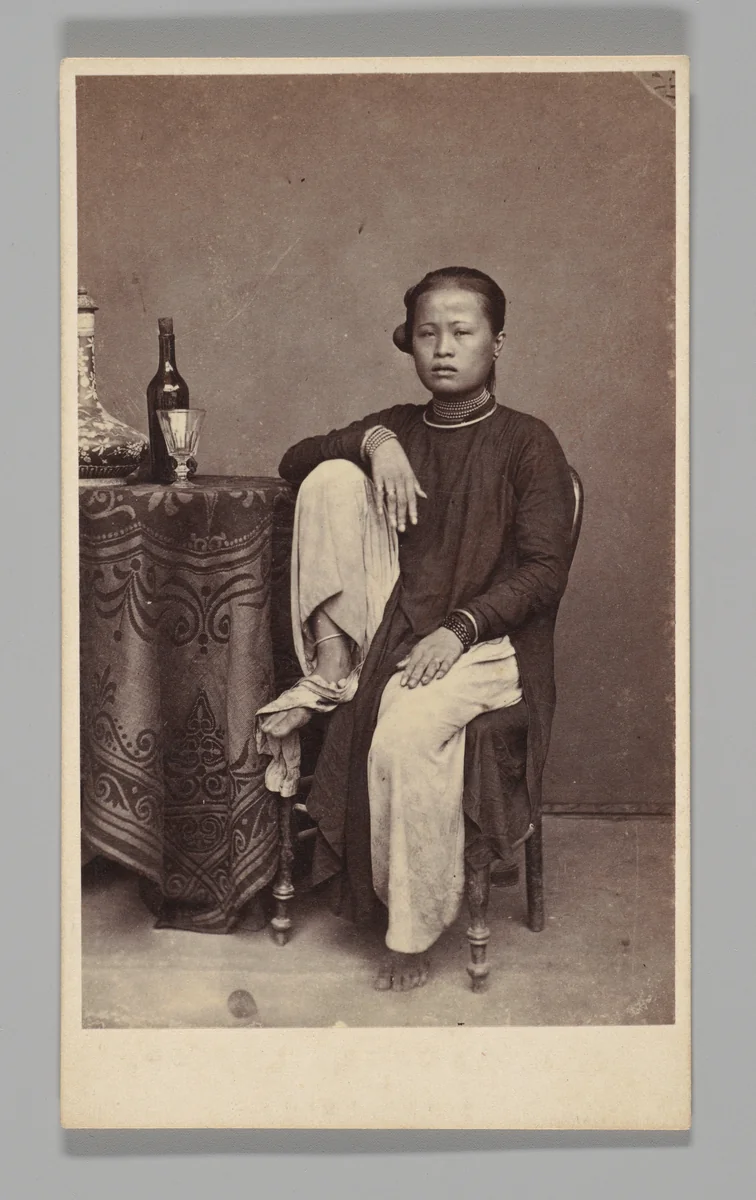 [Studio Portrait: Woman Seated Beside a Table, Singapore] by G. R. Lambert & Co., photograph, 1870-1879