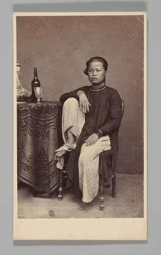 [Studio Portrait: Woman Seated Beside a Table, Singapore] by G. R. Lambert & Co., photograph, 1870-1879