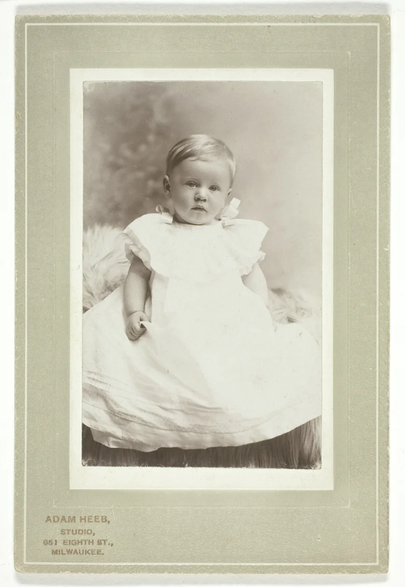 Hugo Tscharuack (in white christening dress) by Adam Heeb, photograph, 1896