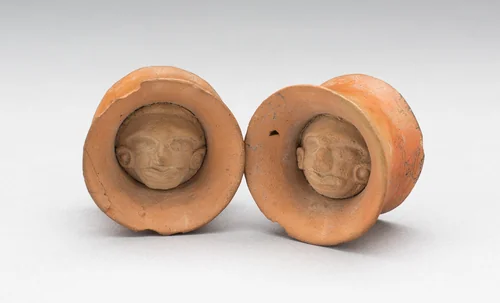 Pair of Earspools with Face in Interior by Possibly Veracruz, Mexico, metalwork, 450-1000
