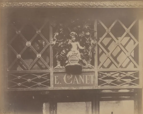 Au Petit Bacchus, rue St Louis en l'Ile, 61 (enseigne) by Eugène Atget, photograph, 1901