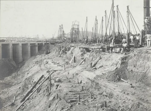 Balboa Terminals. Dry Dock #1. Drilling on Cofferdam. Central portion ready for blasting. Piles being driven to prevent loss of unloaded holes at time of blasting by Unidentified Photographer, photograph, 1916