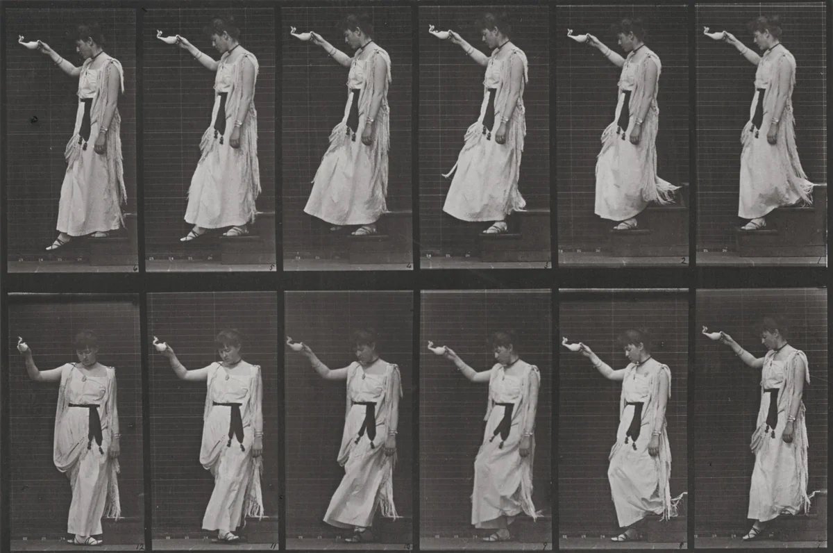 Plate Number 135. Descending stairs and turning, a lamp in right hand by Eadweard Muybridge, photograph, 1887