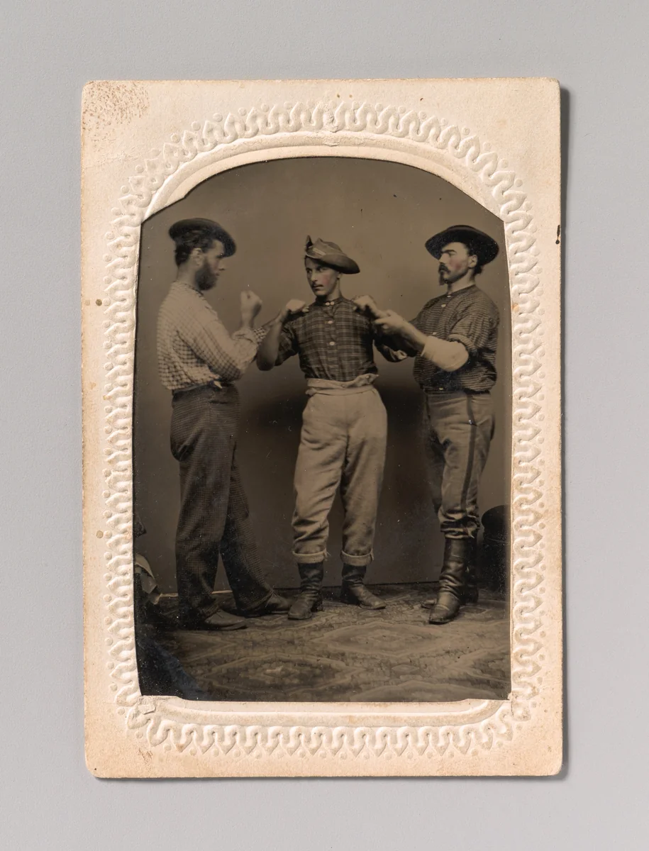 [Two Men in Boxing Stance, a Third Man Adjusting One Man's Form] by J. C. Batchelder, photograph, 1860-1889