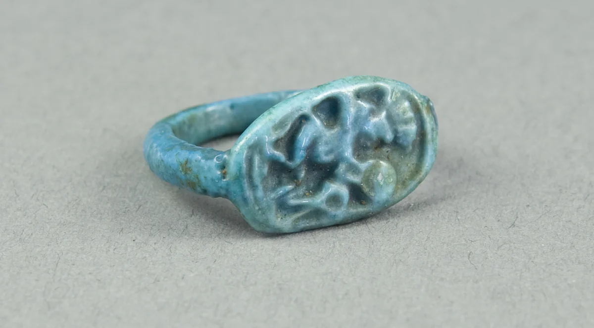 Ring: Figure of Bes playing frame drum, sa (protection) before him by Egyptian, metalwork, -1390