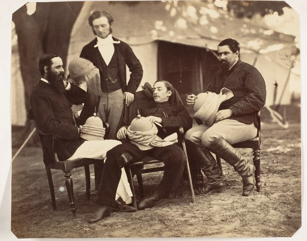 [Group portrait at the Governor Generals Camp, L-R: Maj Jones, Mr. Walters, The Governor Generals Chaplain, J.C.S. and Sir E.Campbell Bart., 60th Rifles Mry. Sry. to G.G.] by Jean Baptiste Oscar Mallitte, photograph, 1858-1861