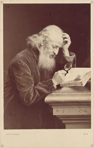 [Bearded Man with Magnifying Glass Examining a Manuscript] by Antoine-Samuel Adam-Salomon, photograph, 1870-1879