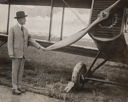 "President Coolidge Wears His Rubbers to Inspect One of the Round-the-World Planes on Their Arrival at the Capital" by Times Wide World Photos, photograph, 1924