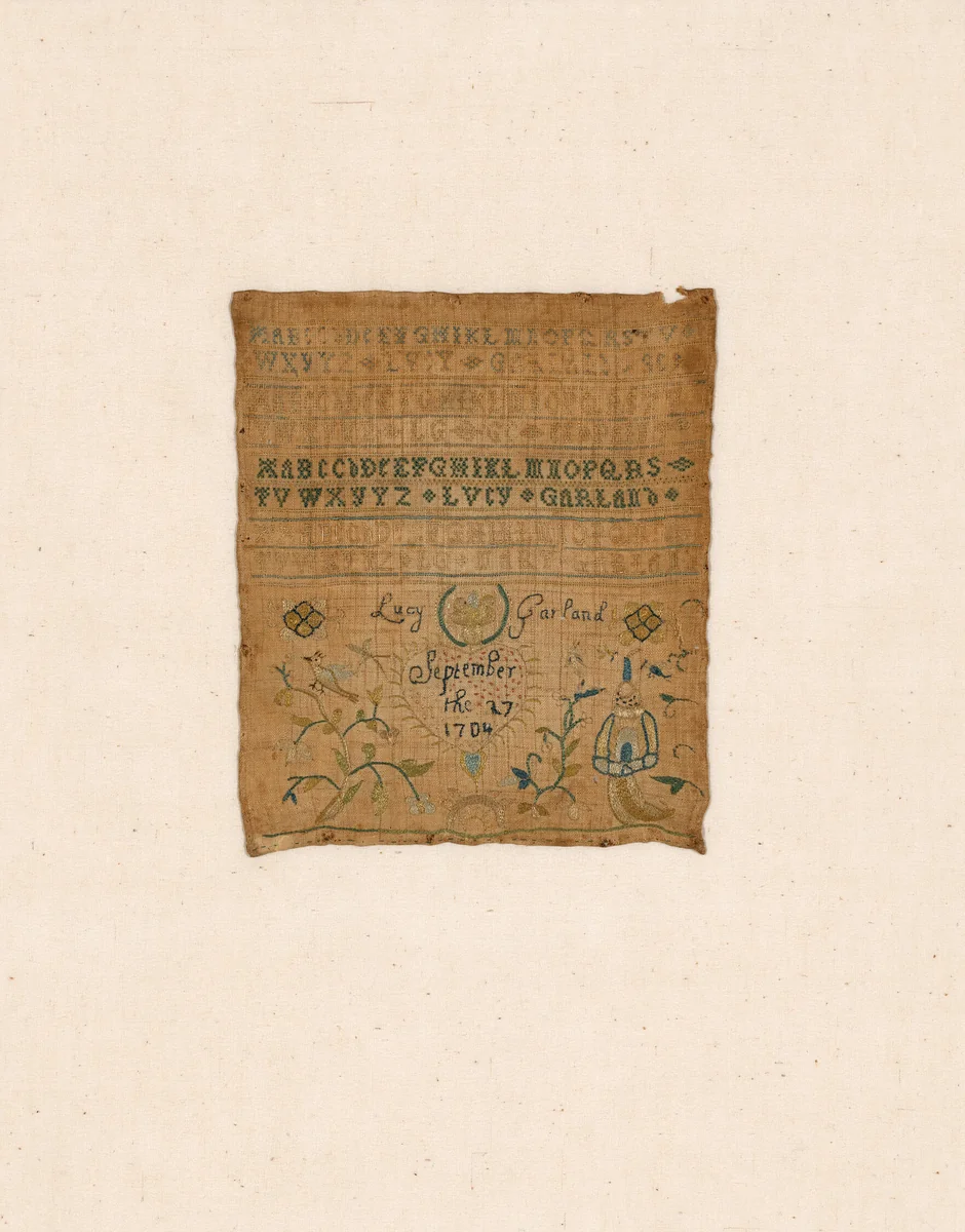 Sampler by Lucy Garland, textile, 1704