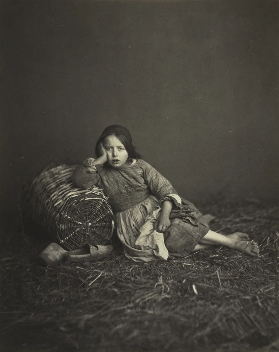 Young Girl Seated on Straw, Leaning on a Basket by Edmond Bacot, photograph, 1862
