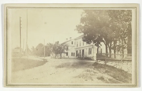 Untitled (view of road with white clapboard houses) by T. Holmes, photograph, 1850-1899