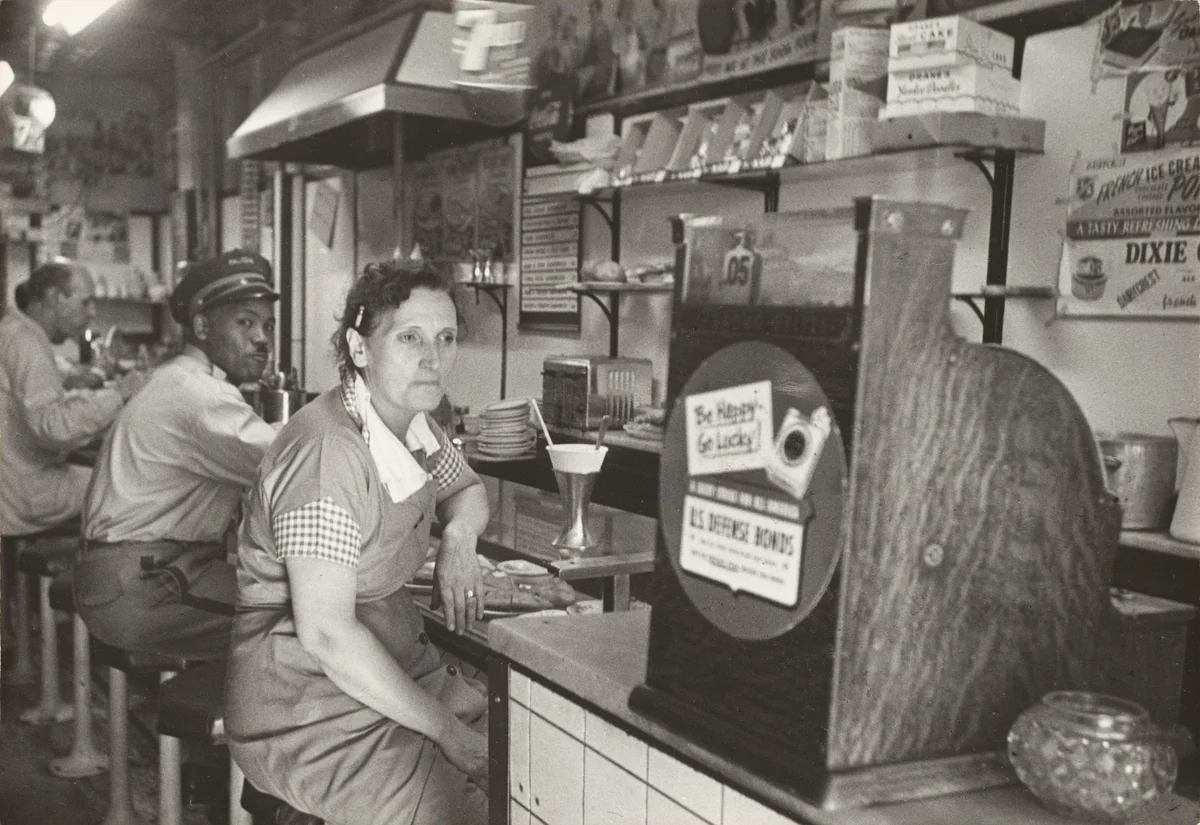 Lena is through working. It is 3 PM and she will soon go home. by Robert Frank, photograph, 1951