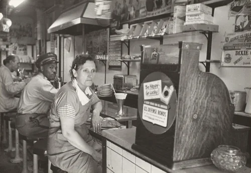 Lena is through working. It is 3 PM and she will soon go home. by Robert Frank, photograph, 1951