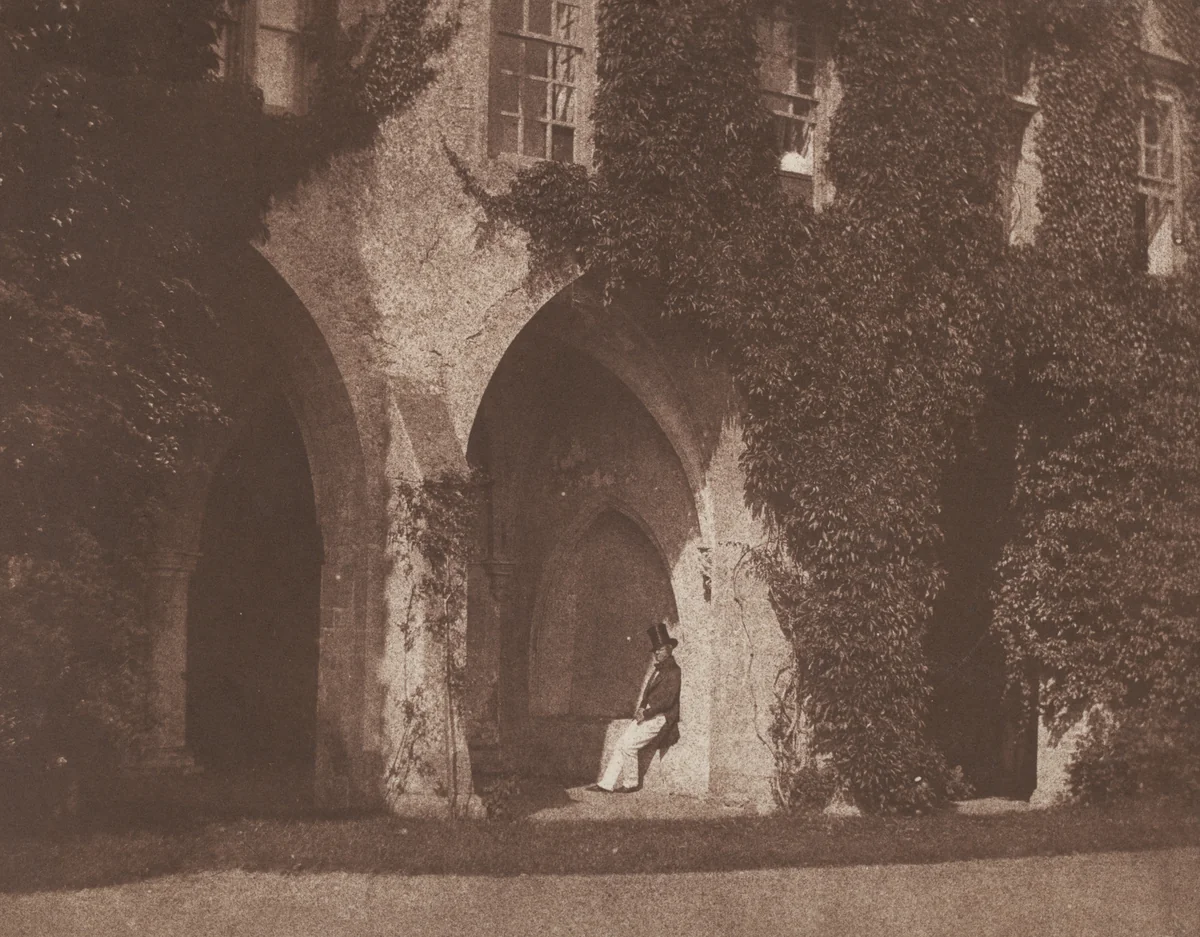Seated Figure in the Cloisters, Lacock Abbey by William Henry Fox Talbot, photograph, 1844