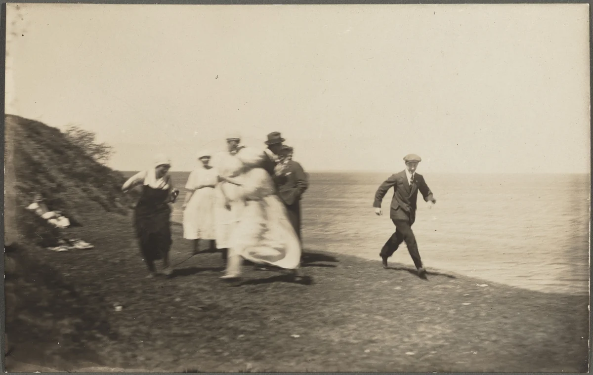 Untitled (Blurred group in motion on beach) by American 20th Century, photograph, 1900-1920