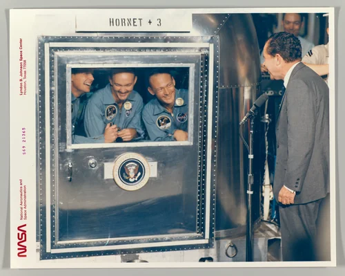 [President Richard M. Nixon Welcomes the Apollo 11 Astronauts Aboard Recovery Ship USS Hornet] by National Aeronautics and Space Administration, photograph, 1964-1974