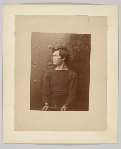 [Lewis Payne (Lewis Powell), Lincoln Assassination Conspirator, in Sweater, Seated and Manacled on the USS Saugus, Washington Navy Yard] by Alexander Gardner, photograph, 1865