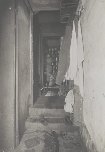 Untitled (crime scene: view down hall with shoes on steps) by Unidentified Photographer, photograph, 1913