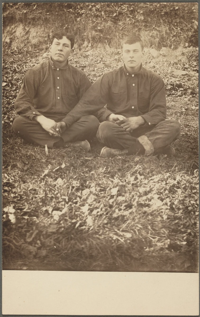 Untitled (Seated men holding hands) by American 20th Century, photograph, 1900-1920