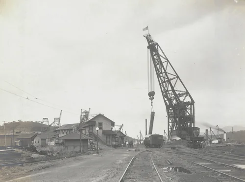 Floating crane "Hercules" pulling 6 ft caissons at reloader wharf coaling plant by Unidentified Photographer, photograph, 1915