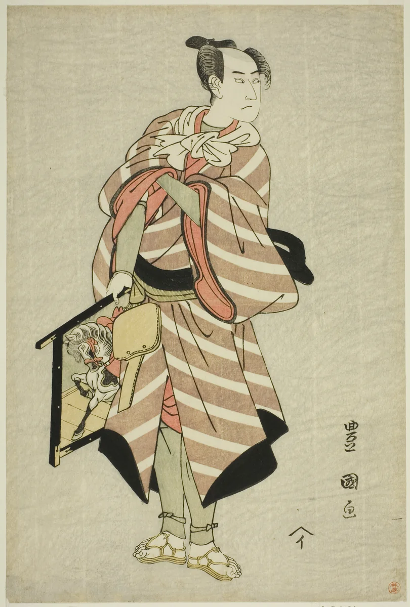 The actor Sawamura Sojuro III as the packhorse-man Muchizo in the play "Miyamairi Musubi no Kamigaki," performed at the Kiri Theater in the eleventh month, 1797 by Utagawa Toyokuni I (初代 歌川 豊国), print, 1792-1802