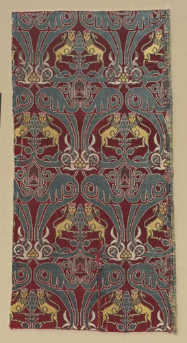 Fragment with crowned lions, palmettes, and escutcheons by Unknown, textile, 1400-1599
