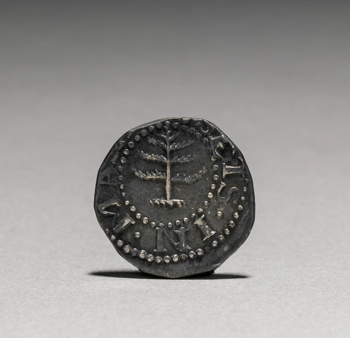 Pine Tree Sixpence (obverse) by John Hull, metalwork, 1652