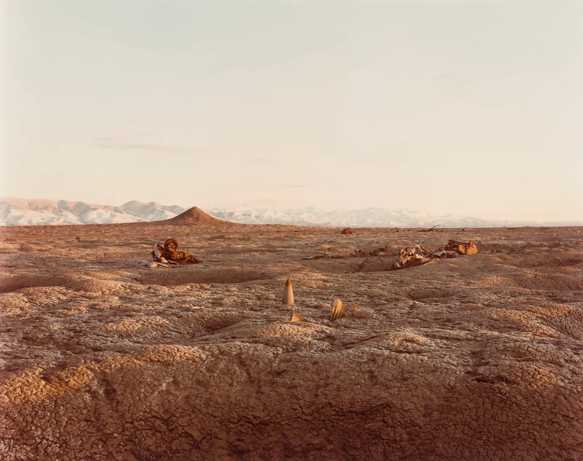 Bomb, Destroyed Vehicles, and Lone Rock, Bravo 20 Bombing Range, Nevada by Richard Misrach, photograph, 1987