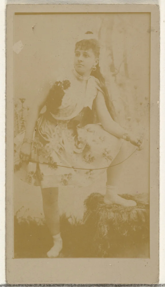 [Actress posing with foot on stool], from the Actors and Actresses series (N145-8) issued by Duke Sons & Co. to promote Duke Cigarettes by W. Duke, Sons & Co., photograph, 1890-1895
