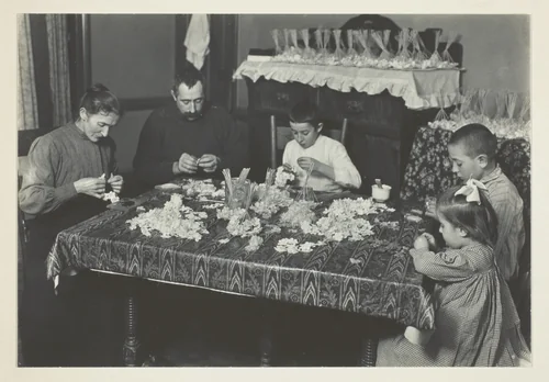Family Making Flowers by Lewis Wickes Hine, photograph, 1910-1920