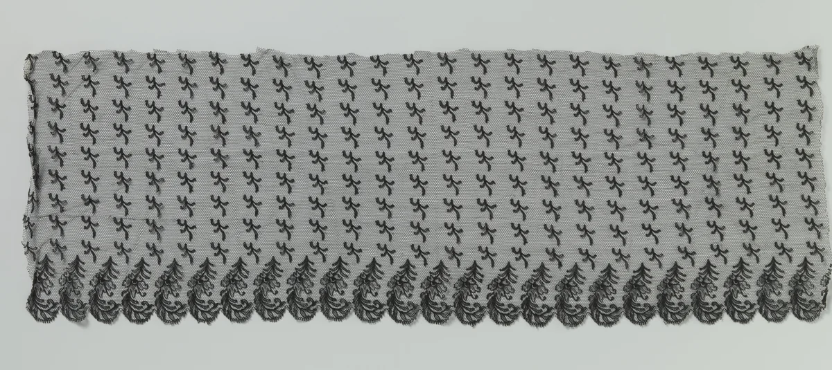 Strook zwarte machinale kant met een onderzijde van j-vormige gevederde bladeren met bloem by anonymous, other, 1885-1895