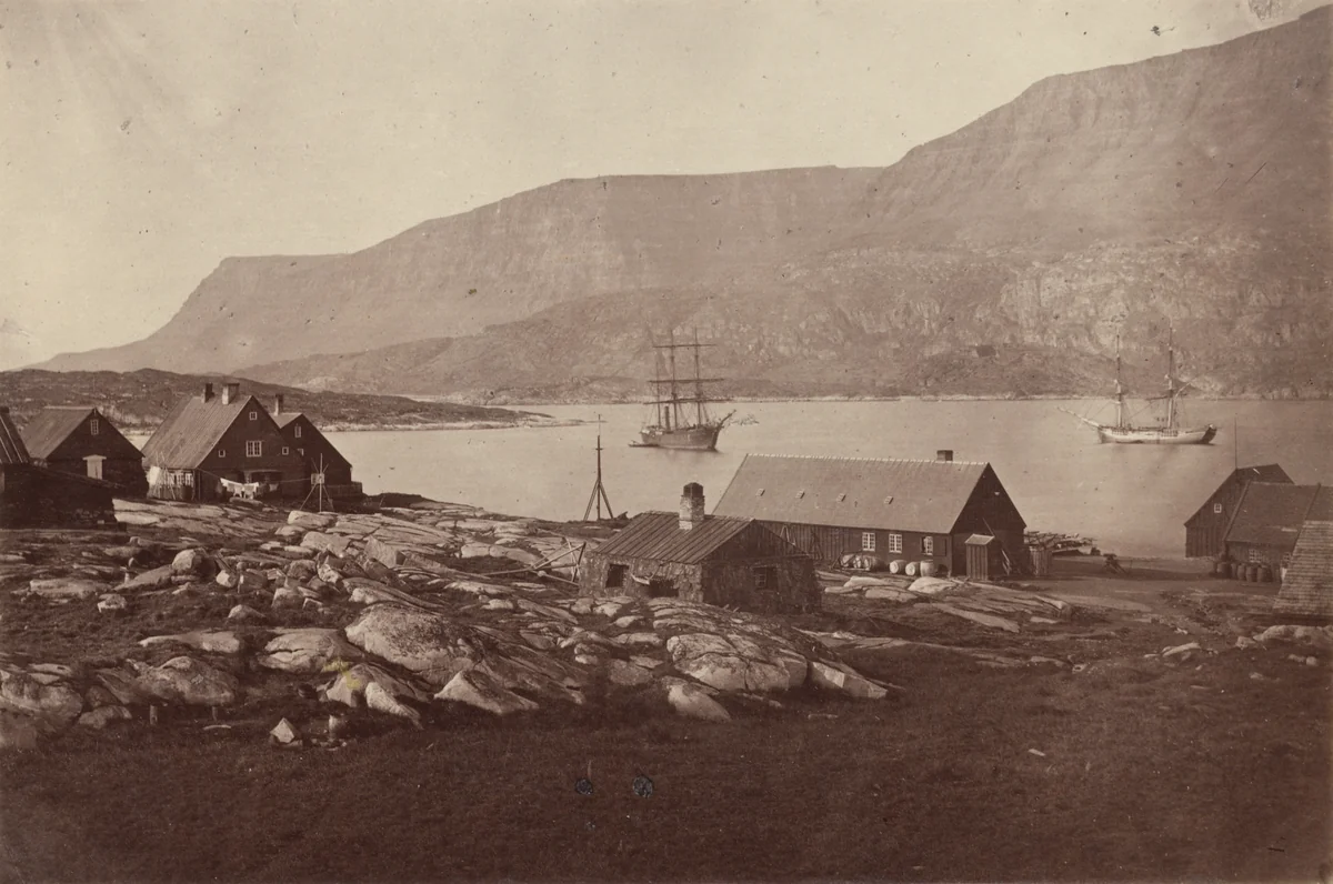 "View of settlement and harbour of Godhavn, on the Island of Disco, the entrance is at the left, between the low rocks and the cliffs." by George P. Critcherson, John L. Dunmore, William Bradford, photograph, 1869