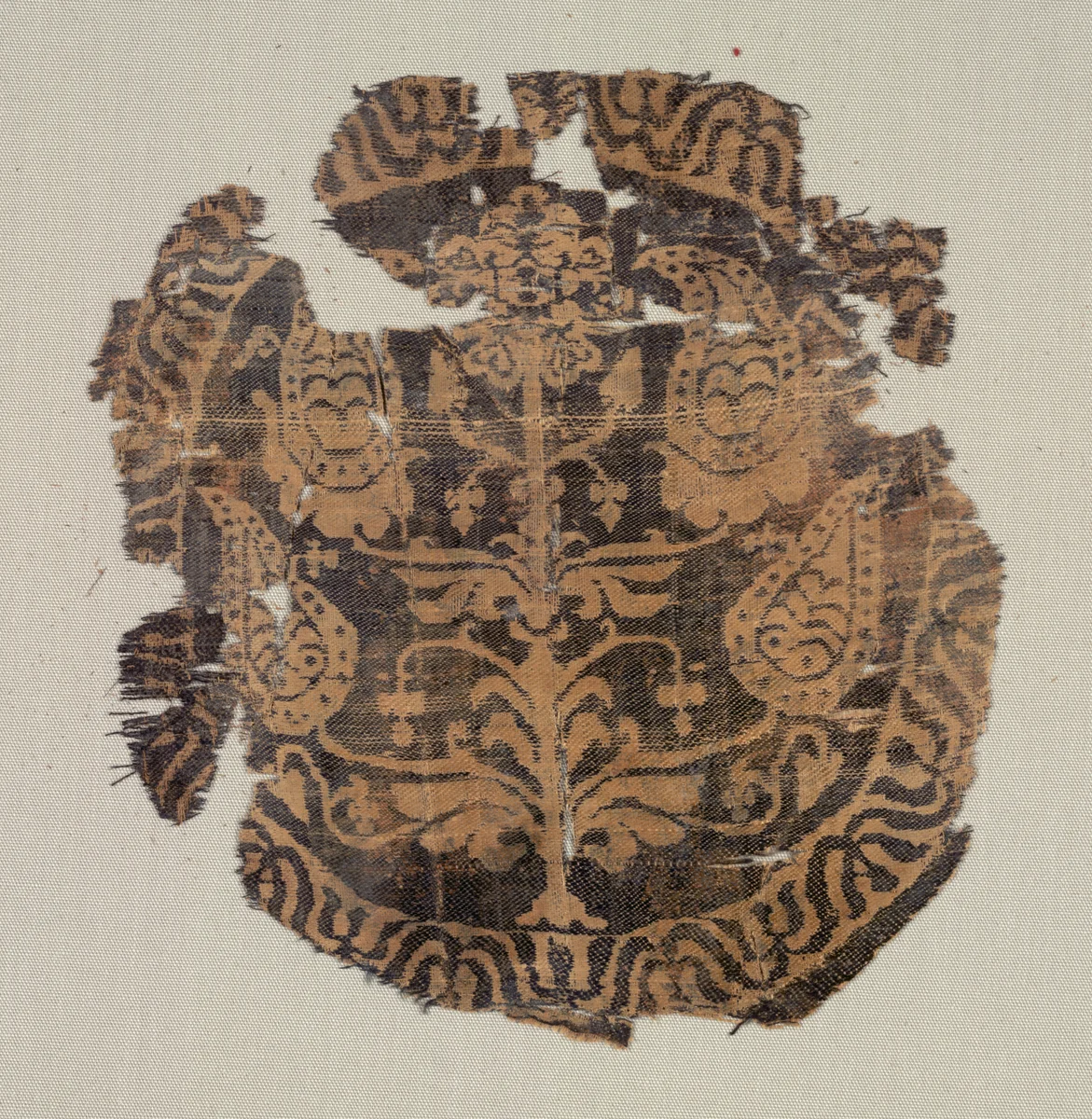 Roundel with curvilinear palmette tree, from a tunic by Unknown, textile, 600-850