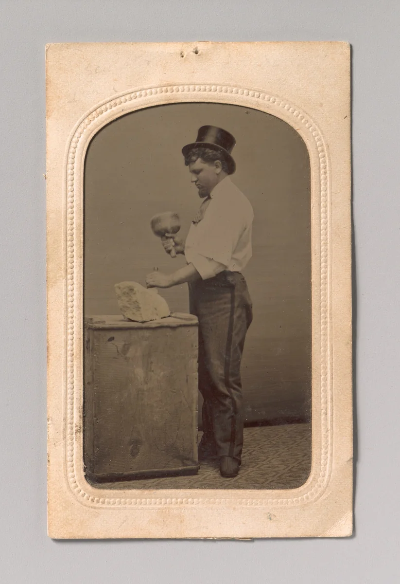 [Mason in Top Hat with Mallet, Chisel, and Piece of Stone] by J. R. Martin, photograph, 1870-1889
