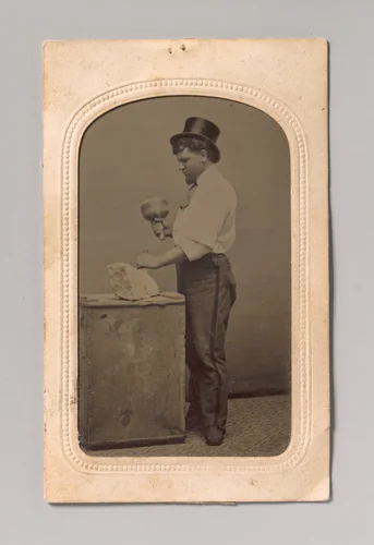 [Mason in Top Hat with Mallet, Chisel, and Piece of Stone] by J. R. Martin, photograph, 1870-1889