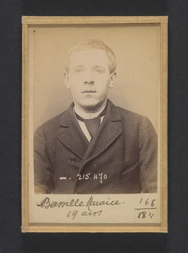 Bassille. Maurice, Eugène. 19 ans, né à Paris Ille. Portefeuilliste. Anarchiste. 9/3/94. by Alphonse Bertillon, photograph, 1894