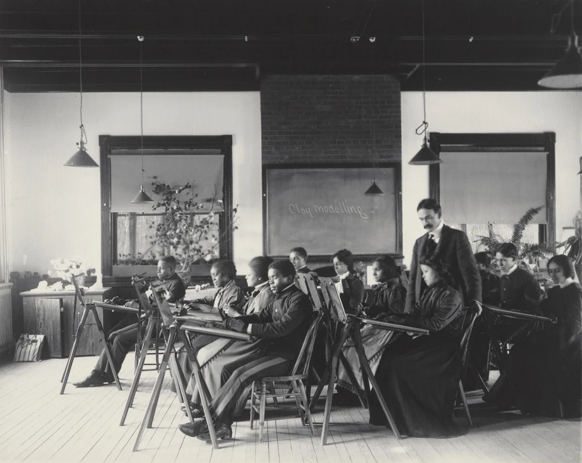Modelling in clay by Frances Benjamin Johnston, photograph, 1899