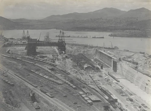 Balboa Terminals. Dry Dock #1. General view from Sosa Hill. Steel erected for building #29. Pumping Plant and Air Compressor Ho. Panama R.R. tracks in permanent location in foreground. Central part of Cofferdam drilled, & drills removed ready for blasting by Unidentified Photographer, photograph, 1916