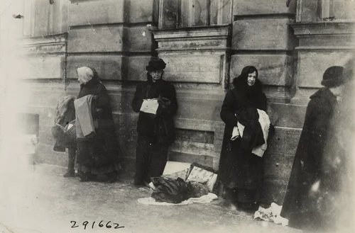 Women Selling the Remnants of Clothing Possessed by Themselves and their Family to Keep them from Starving by Underwood and Underwood, photograph, 1920