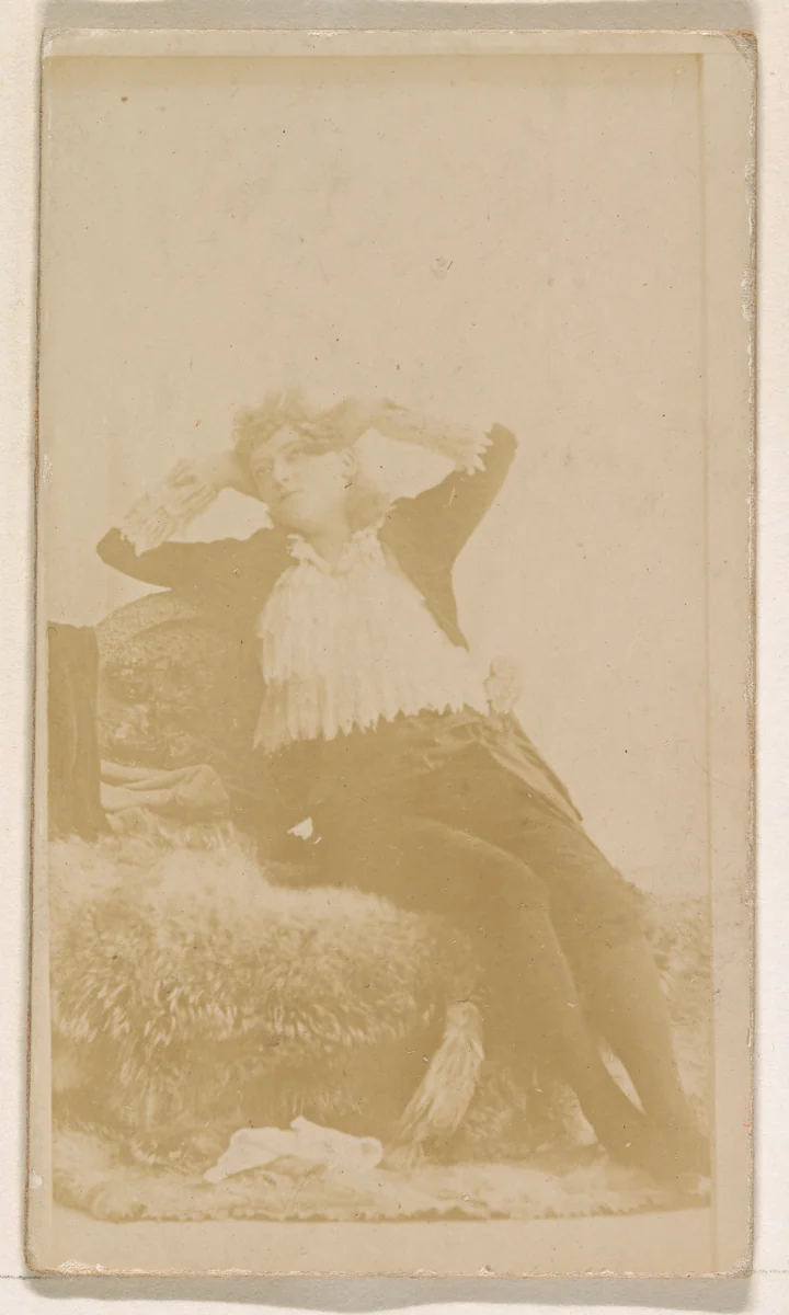 Reclining actress, from the Actresses series (N245) issued by Kinney Brothers to promote Sweet Caporal Cigarettes by Kinney Brothers Tobacco Company, photograph, 1890