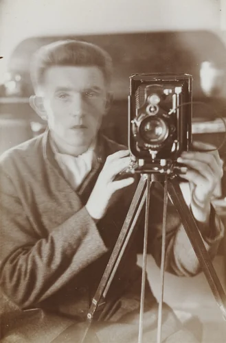 Self-Portrait in Mirror by Otto Lindig, photograph, 1925