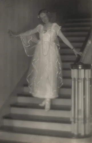 Violet Romer. (on stairs, hand on banister) by Edward Weston, photograph, 1917