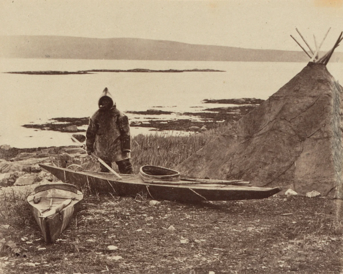 “An Esquimaux getting ready for a seal hunt, his toupek, or skin tent on the right” by George P. Critcherson, John L. Dunmore, William Bradford, photograph, 1869