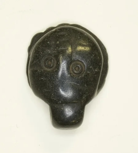 Face Amulet by Egyptian, metalwork, 301-700