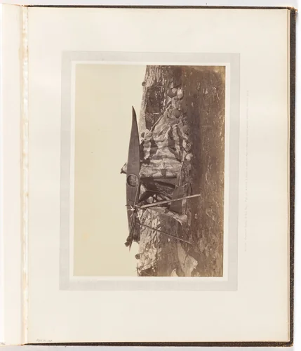 "Esquimaux Toupek or Skin Tent. The boat or kayak is placed on poles to keepit from dogs, which destroy everything they can reach." by George P. Critcherson, John L. Dunmore, William Bradford, photograph, 1869