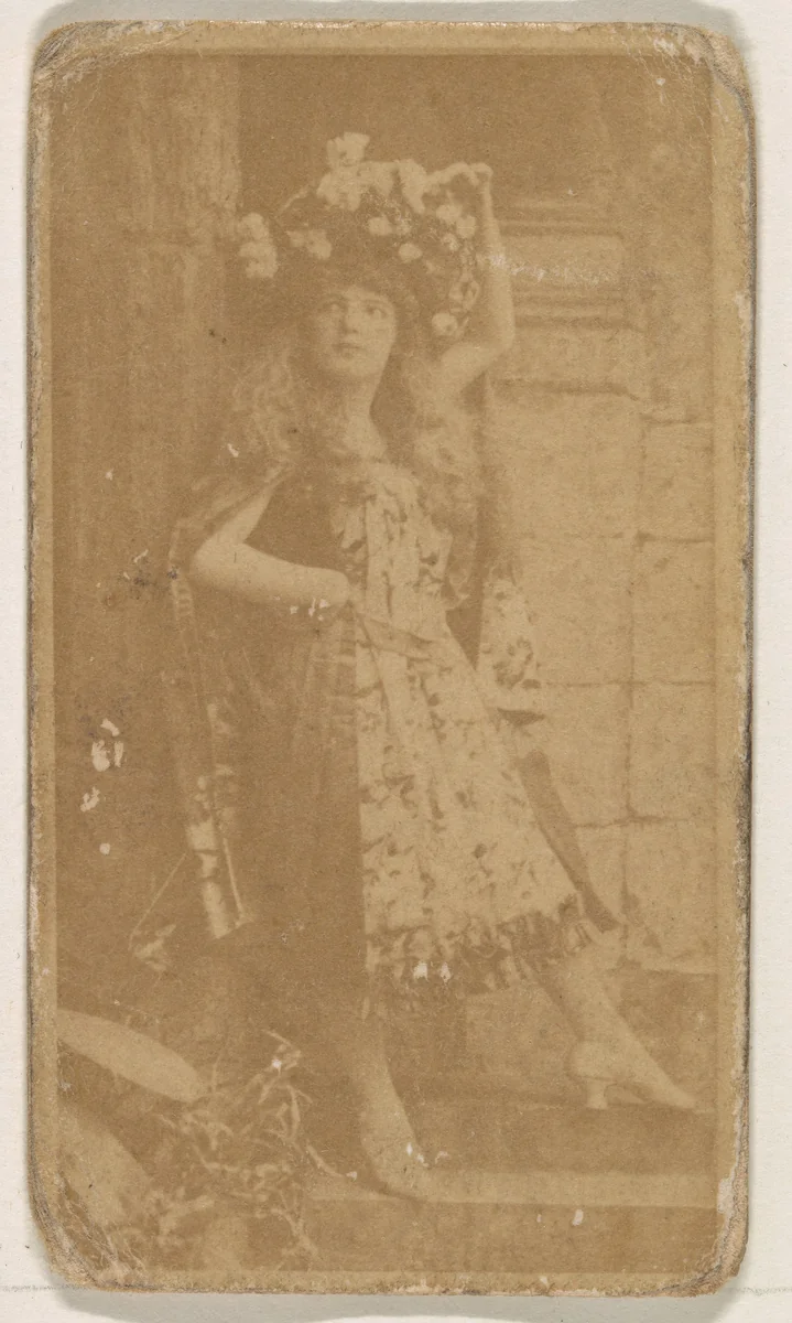 Actress wearing large floral piece in hair, from the Actresses series (N245) issued by Kinney Brothers to promote Sweet Caporal Cigarettes by Kinney Brothers Tobacco Company, photograph, 1890