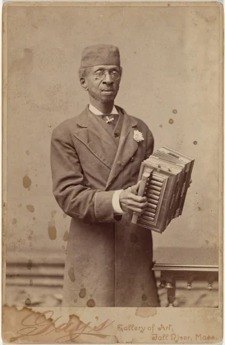 Portrait of a Man Holding an Accordion by Gay’s Gallery of Art, photograph, 1885-1899