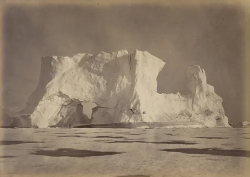 "Castle Berg in Melville Bay over two hundred feet high. The Figure, which is some seventy-five feet from the Base, gives an object to compare with the Berg. The Ice in the foreground is about eighteen inches in thickness." by George P. Critcherson, John L. Dunmore, William Bradford, photograph, 1869