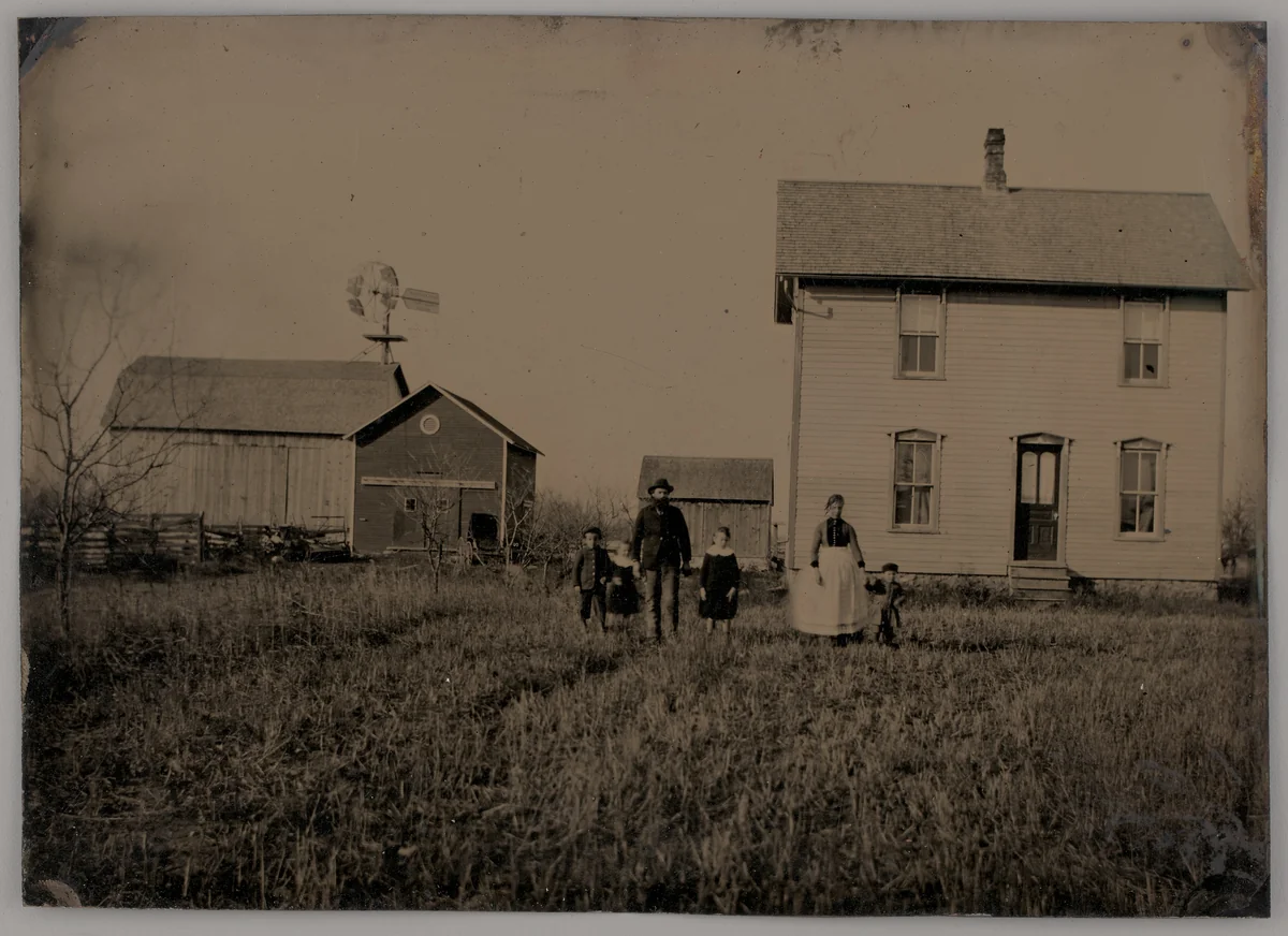 Untitled (A Man, a Woman, and Three Children Standing in Front of a Farmhouse) by Unknown maker, photograph, 1875
