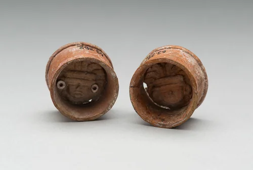 Pair of Ear Plugs with Face of Figure in Interior by Teotihuacan Teotihuacan, ceramic, 300-750